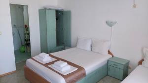 Postel nebo postele na pokoji v ubytování Krai Moreto Guest House