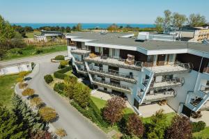 an aerial view of a building with a road at BlueApart Apartamenty Na Klifie in Władysławowo