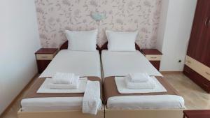 Postel nebo postele na pokoji v ubytování Krai Moreto Guest House