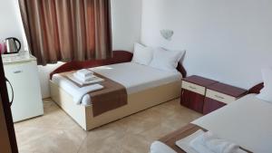 Postel nebo postele na pokoji v ubytování Krai Moreto Guest House