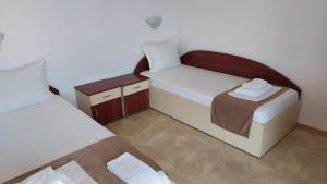 Postel nebo postele na pokoji v ubytování Krai Moreto Guest House