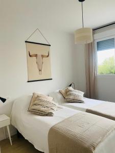 Posteľ alebo postele v izbe v ubytovaní Residencia Jardin del Rio