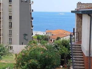 a view of the ocean from a building at Appartamento Perla di Mare in Piombino