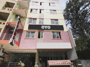 a building with an ovo sign on it at Collection O Tiara Near Christ university in Bengaluru +38 photos
