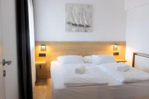 Posteľ alebo postele v izbe v ubytovaní Apartments & rooms Stella Adriatica