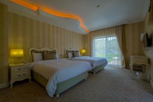 Postel nebo postele na pokoji v ubytování Grand Gocek Hotel