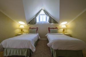 Postel nebo postele na pokoji v ubytování Grand Gocek Hotel