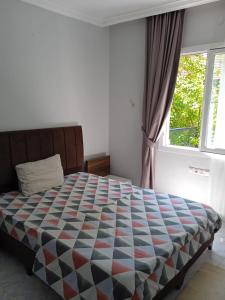 En eller flere senge i et værelse på Beldibi apartment / house / hotel