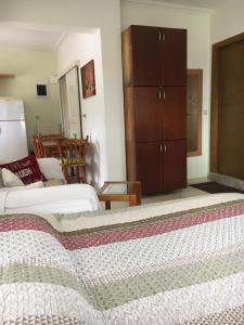 a bedroom with two beds and a dresser at Eva Rooms in Preveza