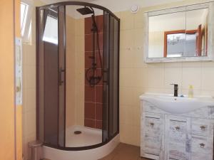 a bathroom with a shower and a sink at Bliźniaki u Very in Łagów