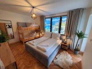 Posteľ alebo postele v izbe v ubytovaní Apartament z jacuzzi Zakopane
