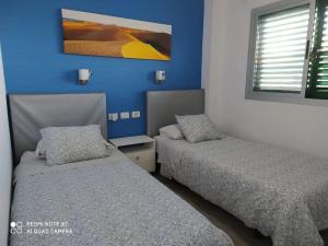 Posteľ alebo postele v izbe v ubytovaní Apartamento Jumilla Vista Mar 35