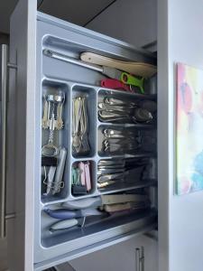 a refrigerator filled with lots of utensils at domek Lawendowy na wiejskiej in Lubiatowo