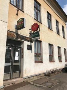 a restaurant with signs on the side of a building at Apartmán na Bohdašíně in Červený Kostelec