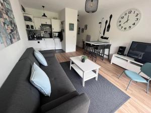 a living room with a couch and a table at Urdina in Saint-Jean-de-Luz