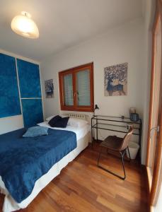 a bedroom with a bed and a chair in it at Valelyhouse in Rome