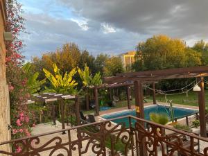 a view of a swimming pool from a balcony at Garden Place Alojamento Local in Viseu