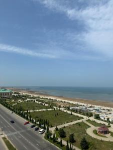an aerial view of a highway next to a beach at Caspian Pearl Residence in Sumqayıt