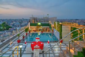 a pool on a cruise ship at night at Hotel Sallow Royal Suites in Amritsar