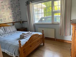 Postel nebo postele na pokoji v ubytování graiguenamanagh Homestay