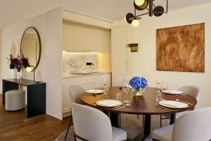 a kitchen and dining room with a table and chairs at Penha Longa Resort in Sintra