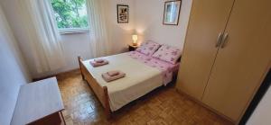 Postel nebo postele na pokoji v ubytování Apartments Pavlakovic by El-Pi Tours