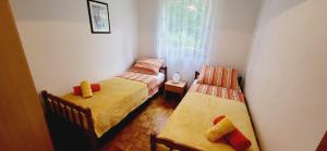 Postel nebo postele na pokoji v ubytování Apartments Pavlakovic by El-Pi Tours