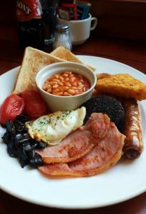 a plate of breakfast food with eggs beans beans and toast at Park Hotel & Apartments in Hull