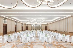 a large banquet hall with white tables and chairs at The Westin Beijing Financial Street in Beijing +59 photos