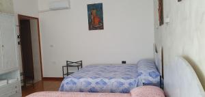 A bed or beds in a room at Le Rustiche Foresteria