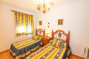Posteľ alebo postele v izbe v ubytovaní La Alondra