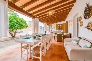 a dining room with a table and a couch at Ideal Property Mallorca - Verdera in Maria de la Salut