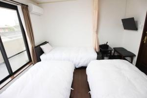 Postel nebo postele na pokoji v ubytování 志摩の別荘