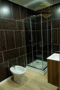 a bathroom with a shower and a toilet and a sink at Refúgio da Suite 5 in Pinhão