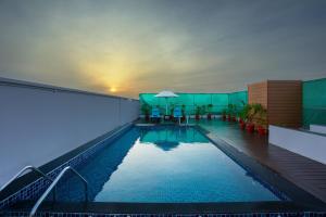 a swimming pool in the middle of a building at Four Points by Sheraton Chennai OMR in Chennai