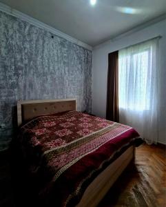 Postel nebo postele na pokoji v ubytování Old House Korolistavi