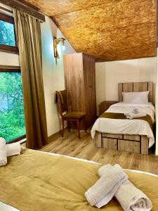 Postel nebo postele na pokoji v ubytování Ojakh Resort