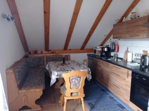 a small kitchen with a table in a room at Drago Kremenjaš in Delnice