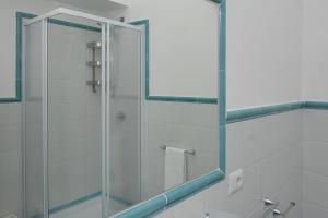 a shower with a glass door in a bathroom at Casa Rosaria in Atrani +31 photos