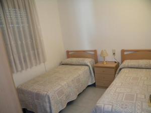 A bed or beds in a room at Apartamentos Miramar-Nautic-Arysal