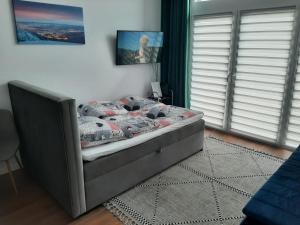 Posteľ alebo postele v izbe v ubytovaní Aparta Lotnisko