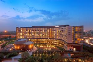 a large building with lights in front of it at The Westin Gurgaon, New Delhi in Gurgaon