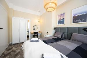 Posteľ alebo postele v izbe v ubytovaní Apartament 110 w centrum Gdyni ProstyWynajem