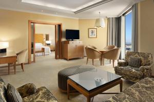 a large hotel room with a living room at Sheraton Dammam Hotel & Convention Centre in Dammam