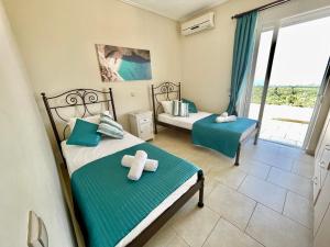 Кровать или кровати в номере Villa Arkadi +24 фотографии