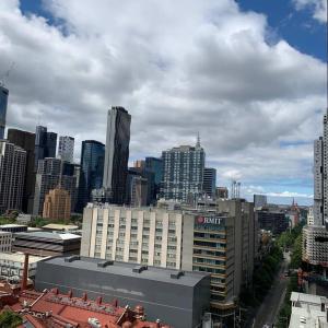 a view of a large city with a building at CBD Spacious Two Bedrooms Apartment in Melbourne