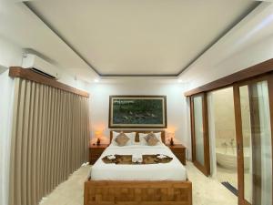 Postel nebo postele na pokoji v ubytování Danakha Villa Ubud