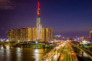 a city skyline at night with a tall building at Vinpearl Landmark 81, Autograph Collection in Ho Chi Minh City