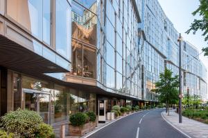 an empty street in a city with tall buildings at Battersea Mall apartment in London