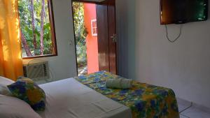 Postel nebo postele na pokoji v ubytování Villa dos Pássaros Paraty Hospedagem